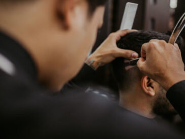 Selective focus photography of a barber